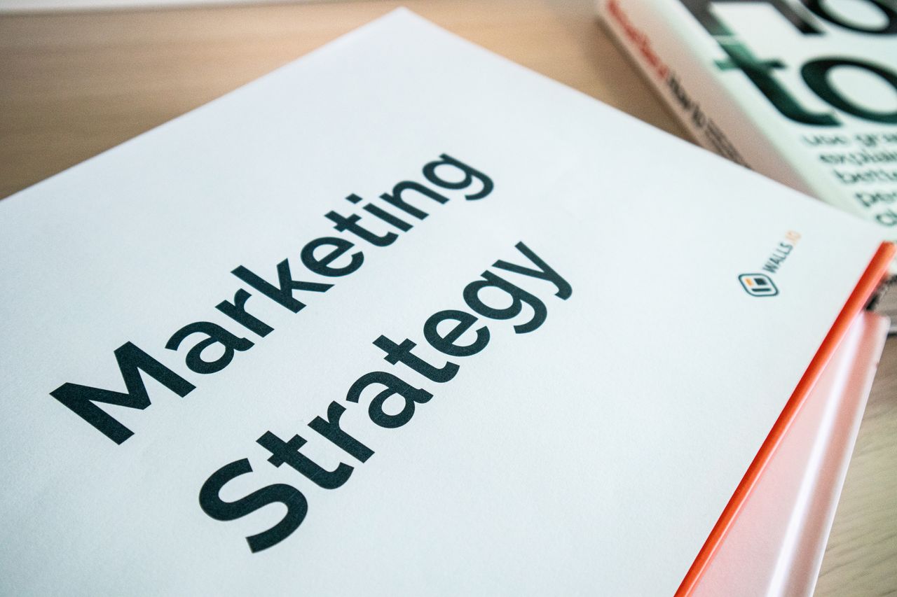 team-03 Close-up of a marketing strategy document on a desk, ideal for business content.