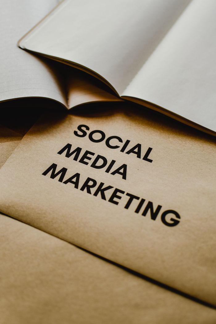 team-01 Close-up of brown envelopes with Social Media Marketing text, ideal for startup themes.